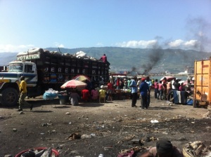Trucks loading up with products to distribute across Haiti